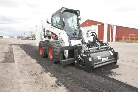 Road milling machine for asphalt surface preparation